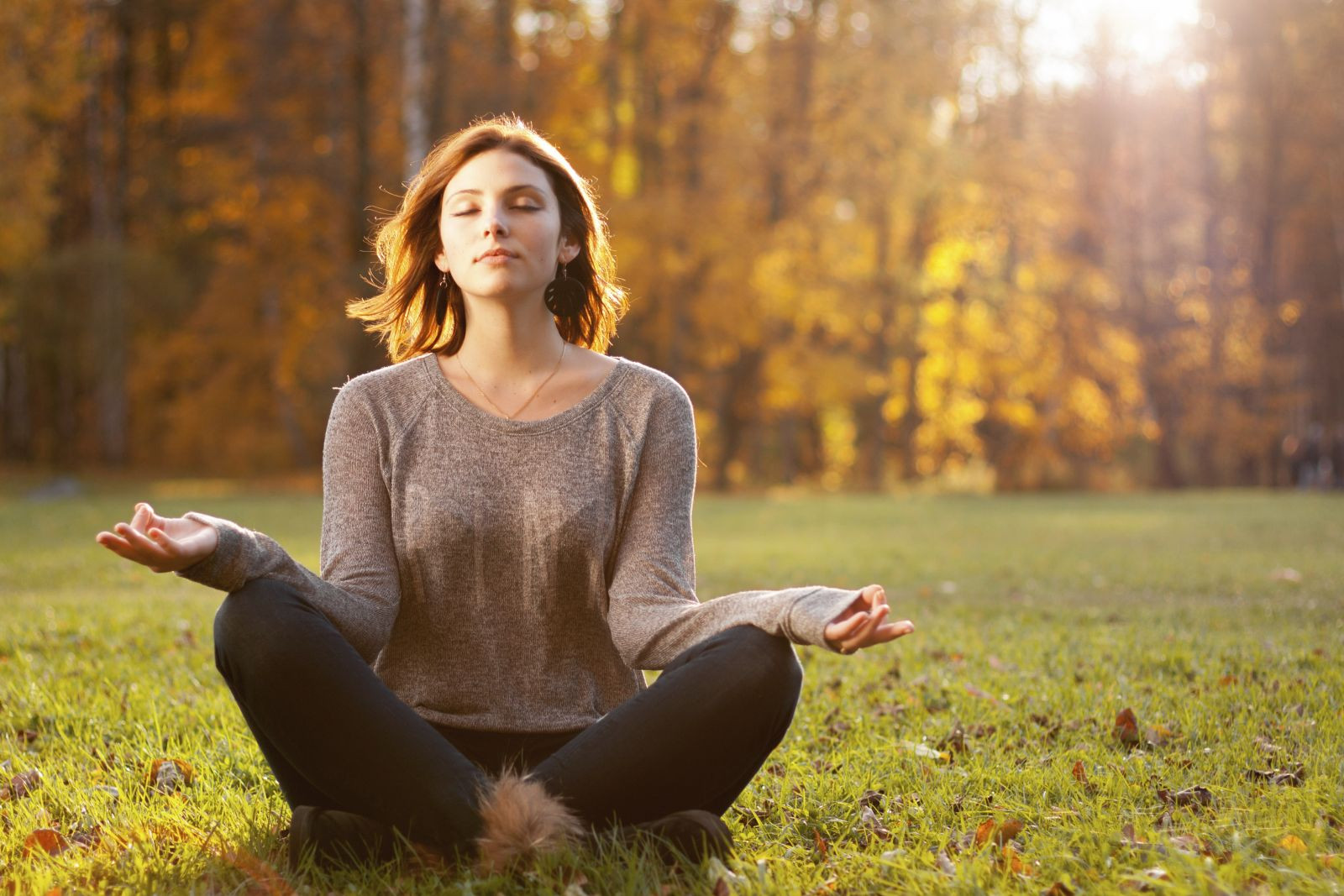 Person practicing mindful concentration in nature